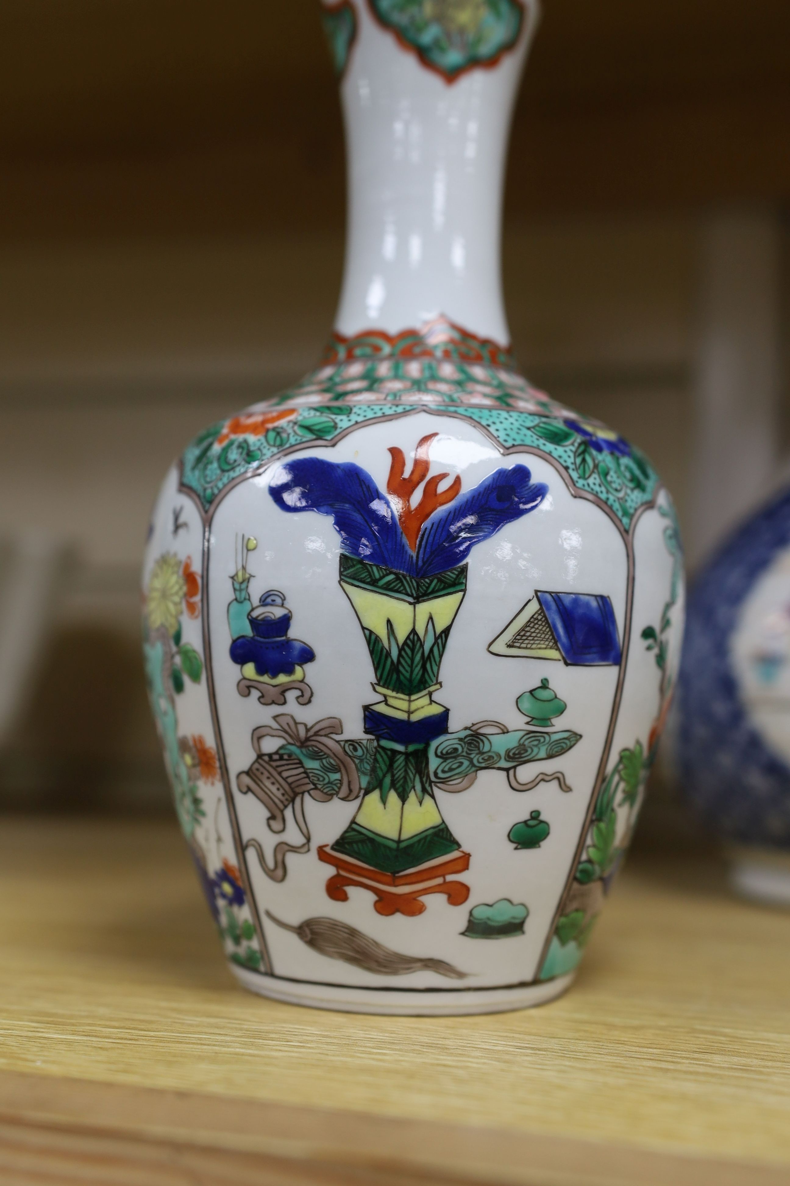A pair Samson of Paris vases in the Chinese famille verte style and a Chinese Qianlong famille rose garlic neck vase with blue panelling motif, tallest 26cm